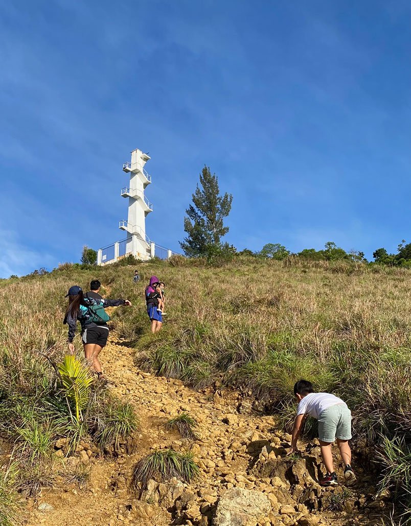 Our family hiking the rocky trail to Aurora Lighthouse in Diguisit, Baler, Aurora.
